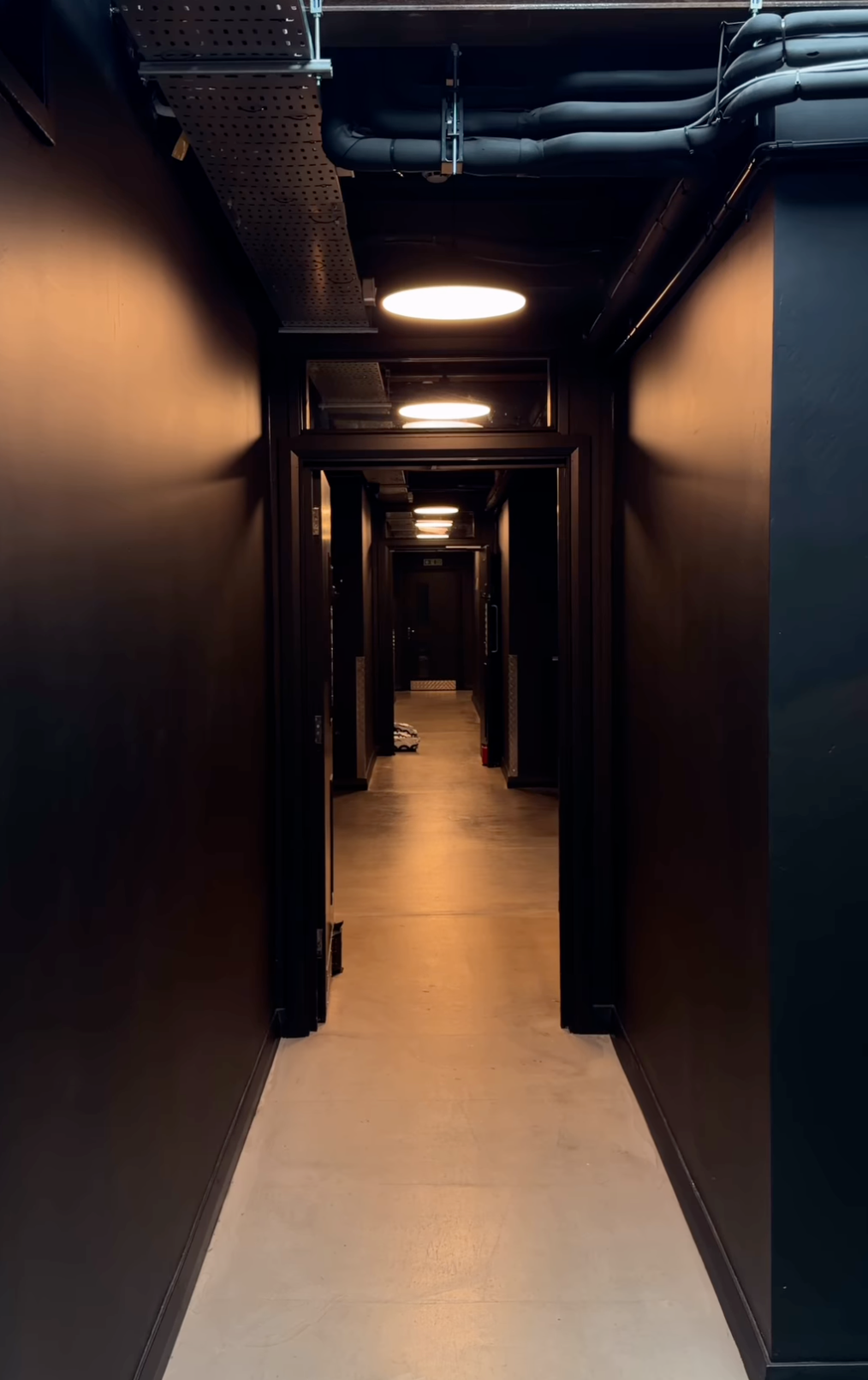 Warmly lit corridor inside Harbour House