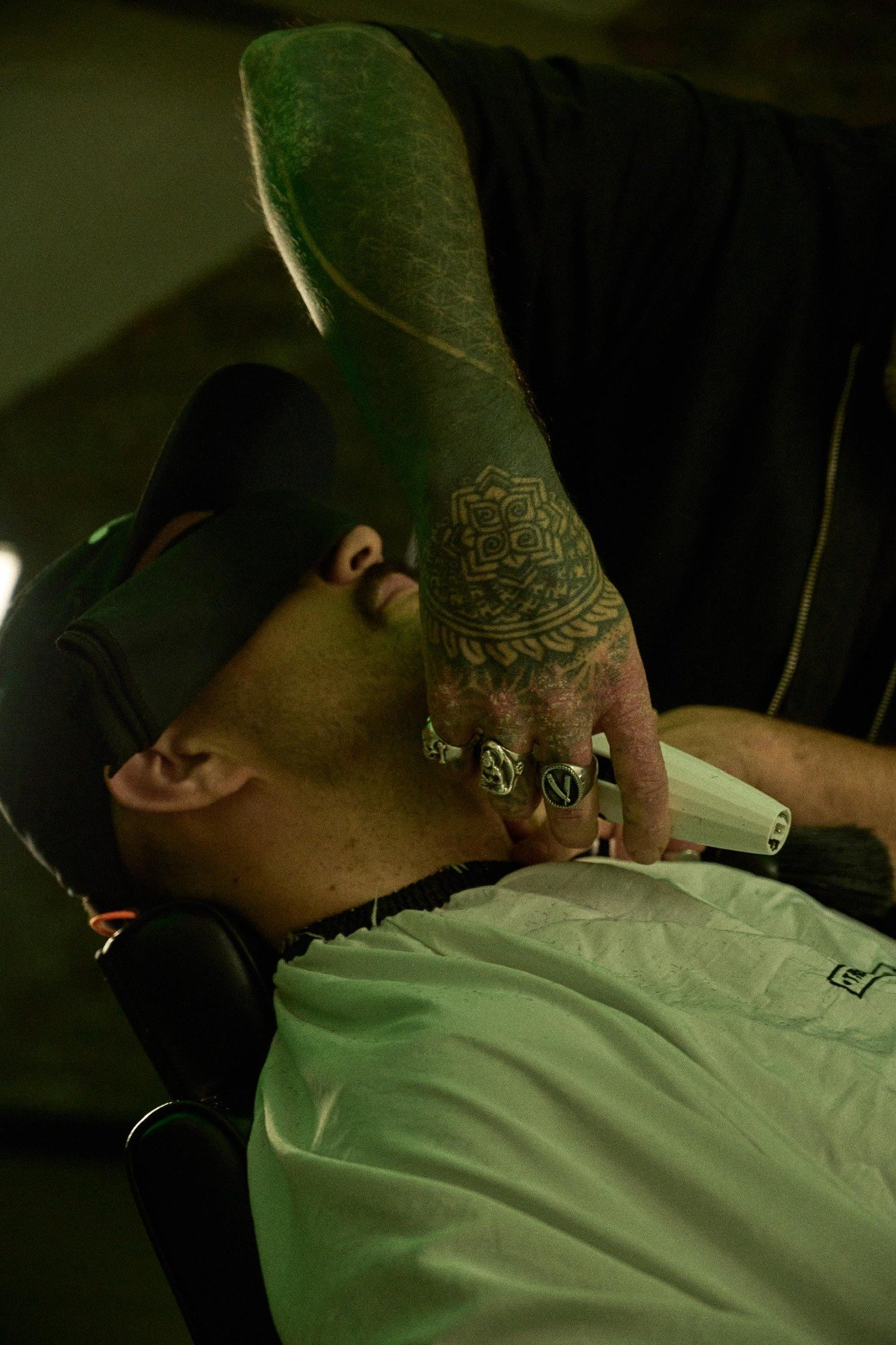 Close-up of an artist tattooing at Harbour House