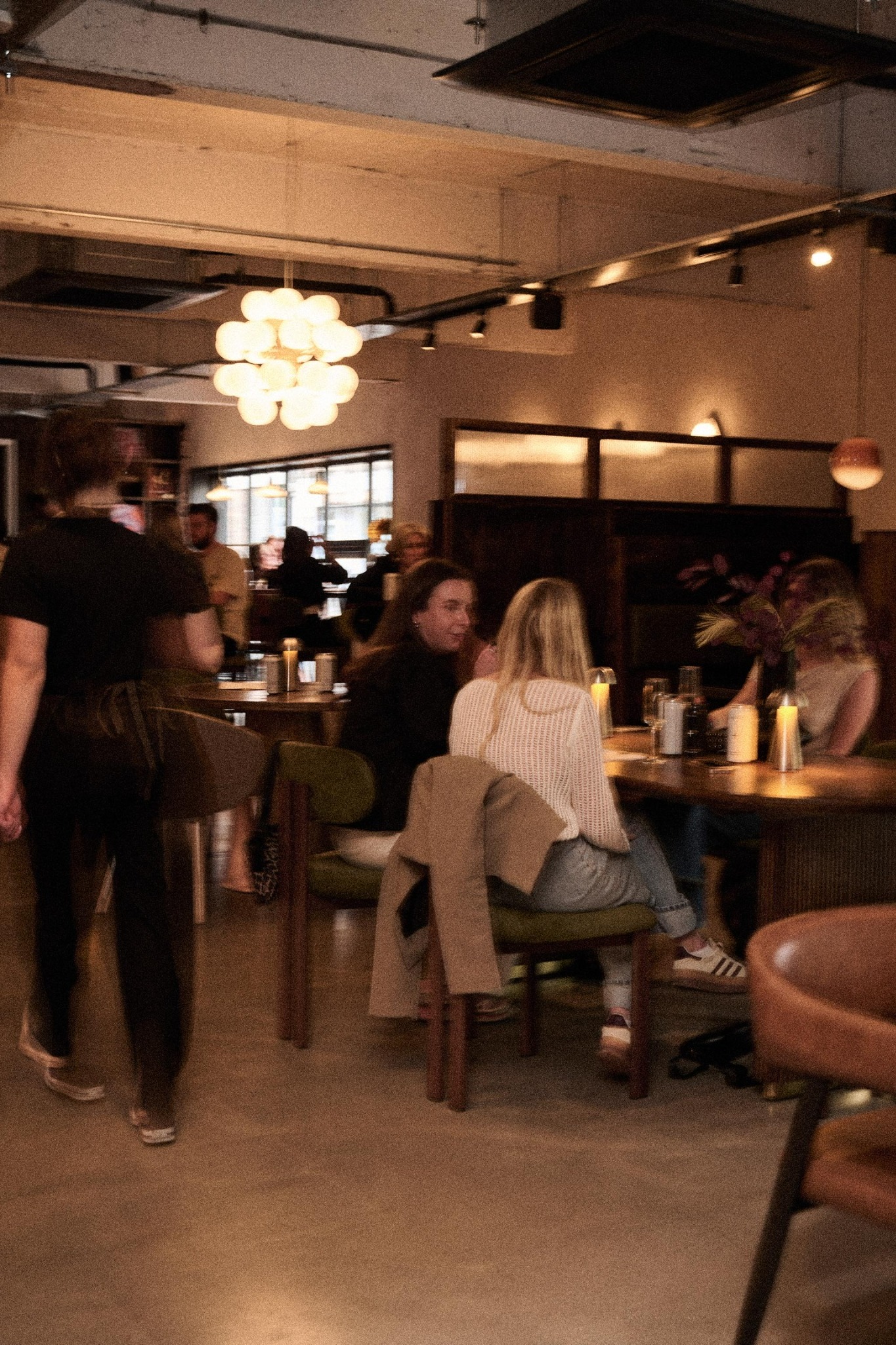 Guests in the warmly lit bar